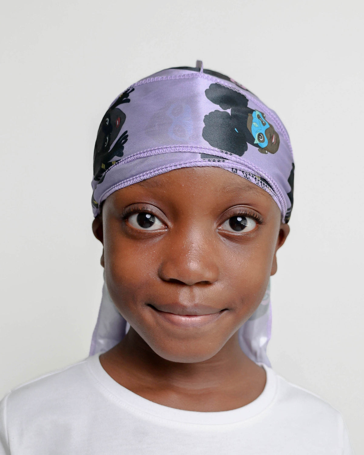 Girl wearing the lavender MY HERO kids satin durag with superhero print, front view